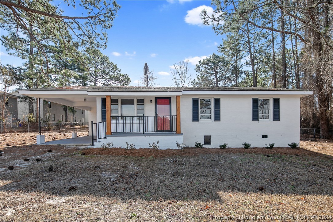 407 Ruth Street Spring Lake, NC 28390 - Photo 1 of 38 a view of a house with a yard and wooden fence