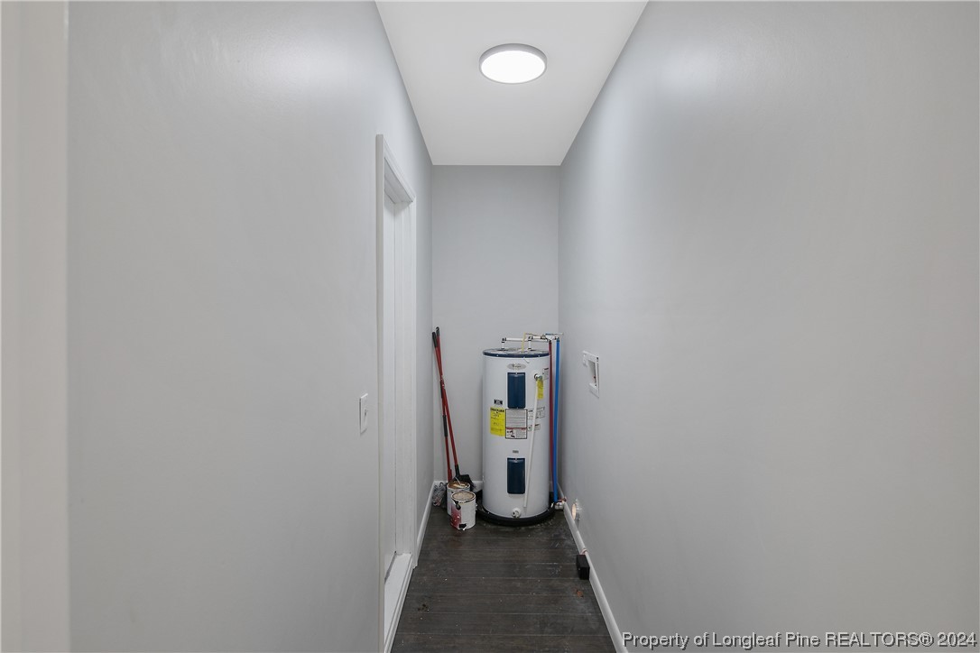 407 Ruth Street Spring Lake, NC 28390 - Photo 18 of 38 a view of a hallway with wooden shelves