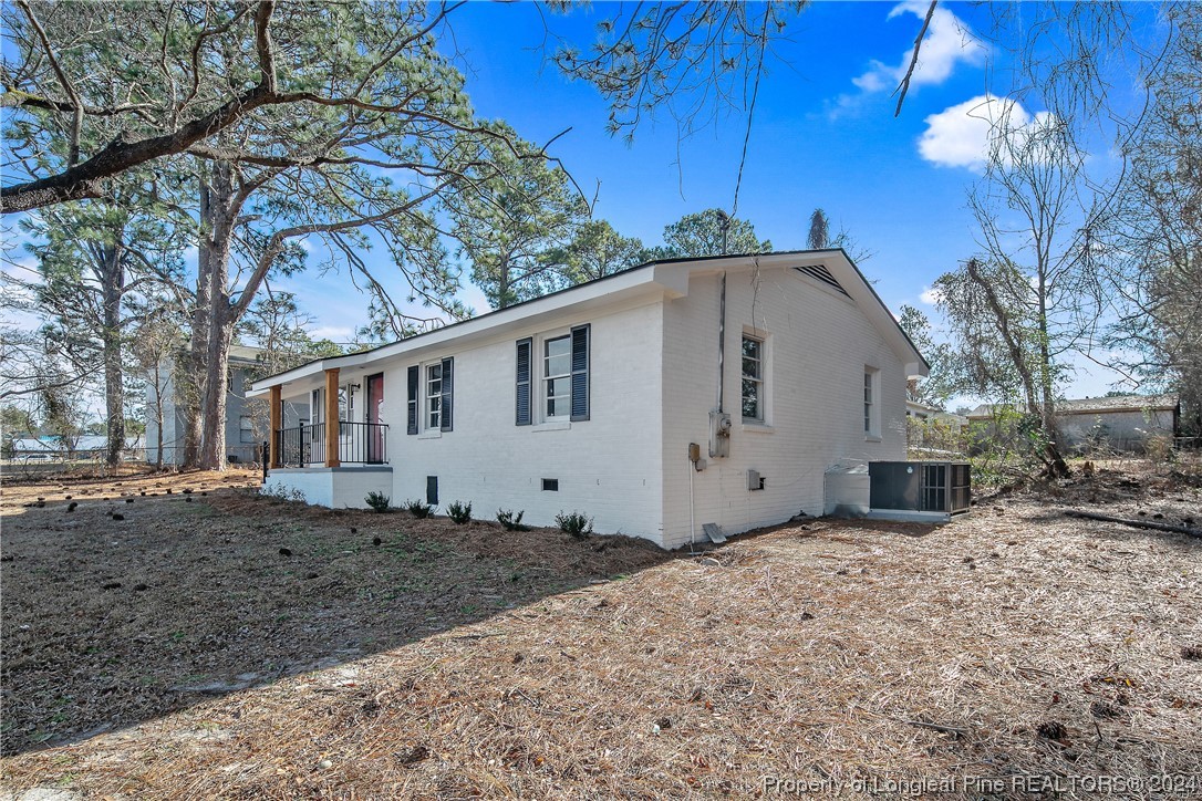 407 Ruth Street Spring Lake, NC 28390 - Photo 2 of 38 a front view of a house with a yard