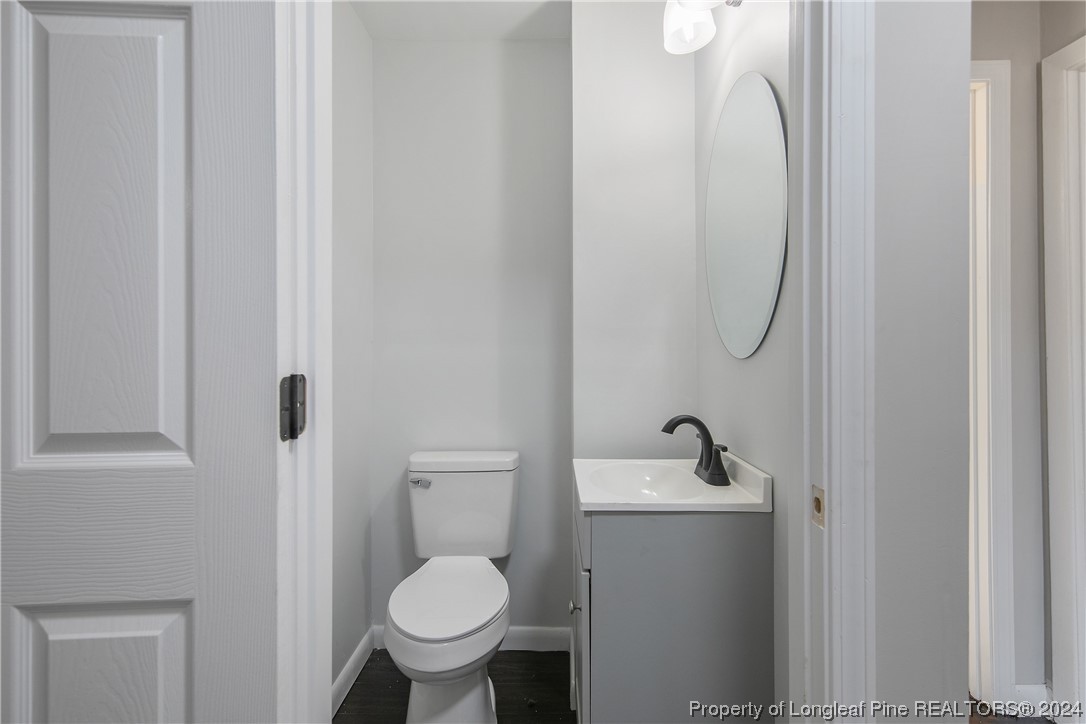 407 Ruth Street Spring Lake, NC 28390 - Photo 23 of 38 a bathroom with a toilet sink and shower
