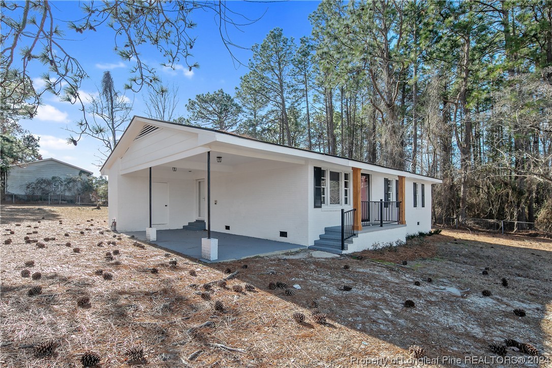 407 Ruth Street Spring Lake, NC 28390 - Photo 3 of 38 a view of a house with a yard