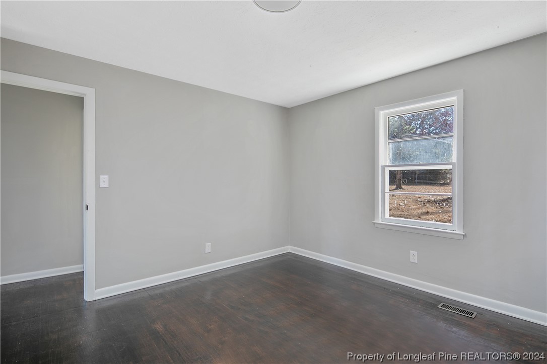407 Ruth Street Spring Lake, NC 28390 - Photo 34 of 38 a view of an empty room with a window