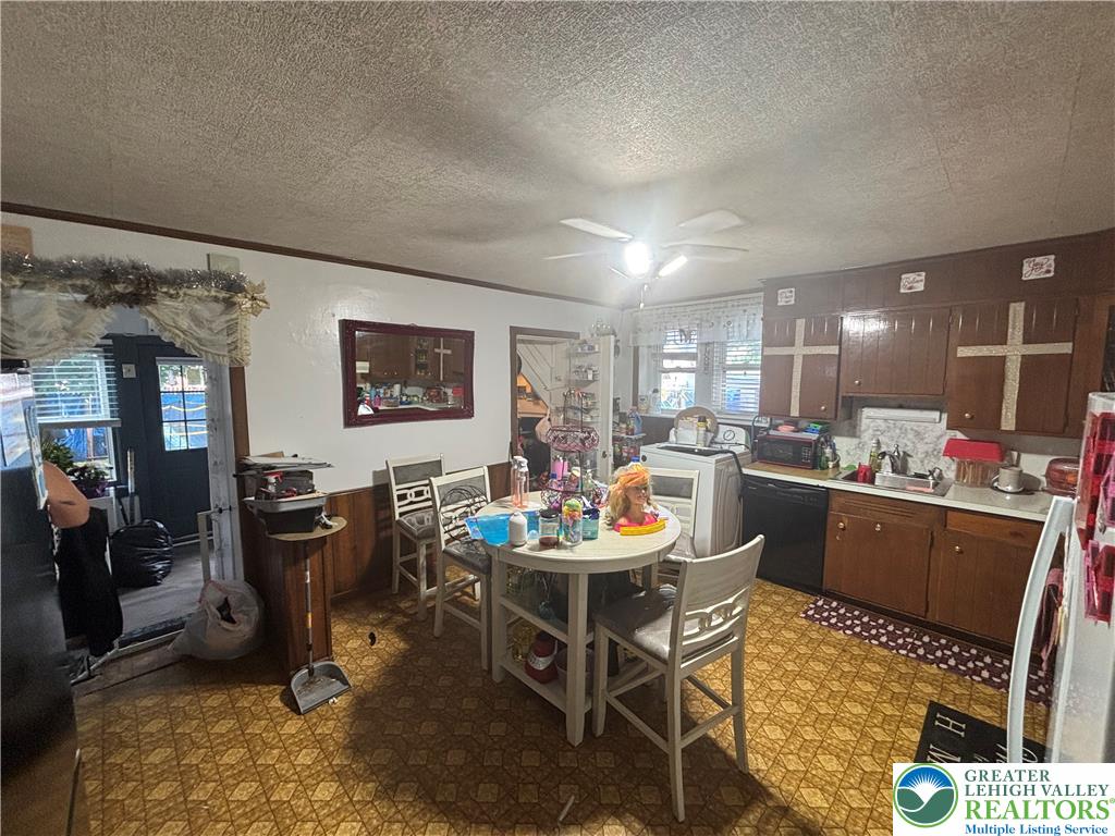 3404 North Ruch Street Whitehall, PA 18052 - Photo 7 of 36 A functional kitchen space featuring ample cabinetry and a practical dining area.