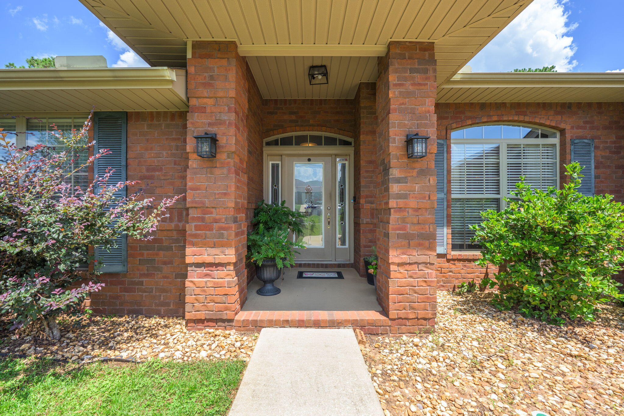 222 Raptor Drive Crestview, FL 32536 - Photo 11 of 70 a front view of a house with garden