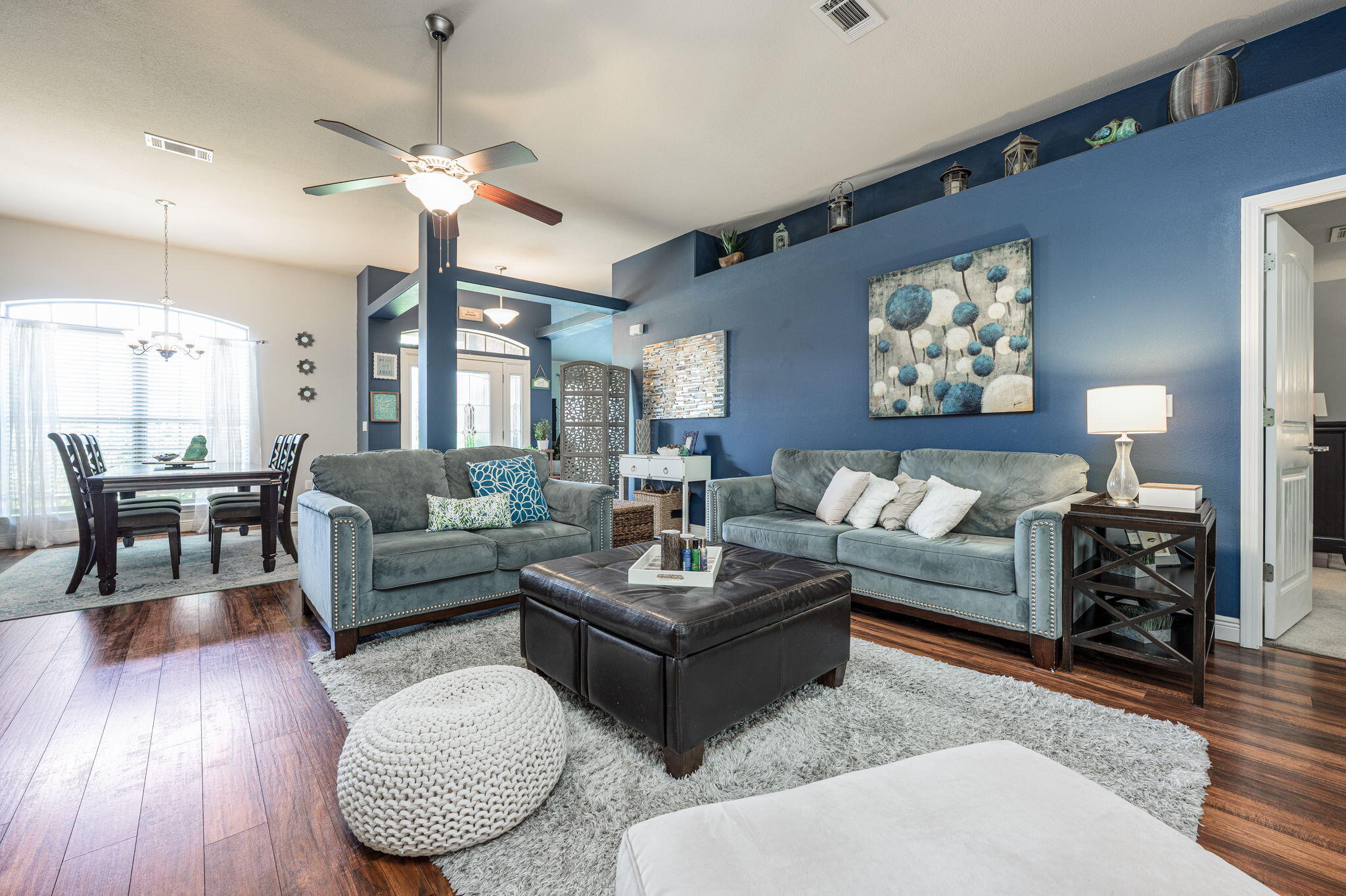 222 Raptor Drive Crestview, FL 32536 - Photo 20 of 70 a living room with furniture a lamp and a chandelier