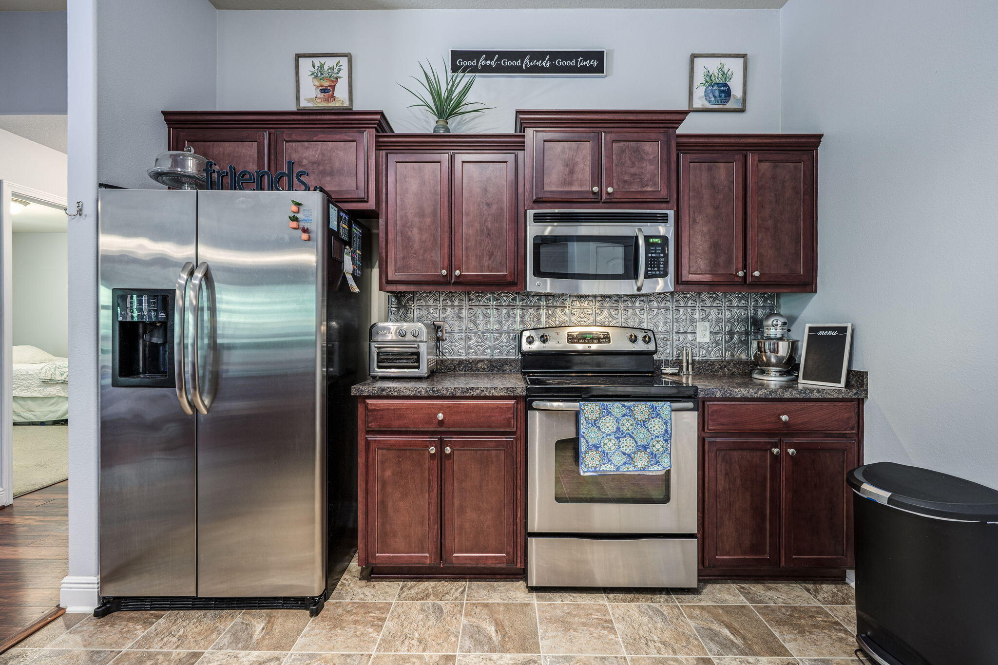 222 Raptor Drive Crestview, FL 32536 - Photo 27 of 70 a kitchen with stainless steel appliances granite countertop a refrigerator stove and oven