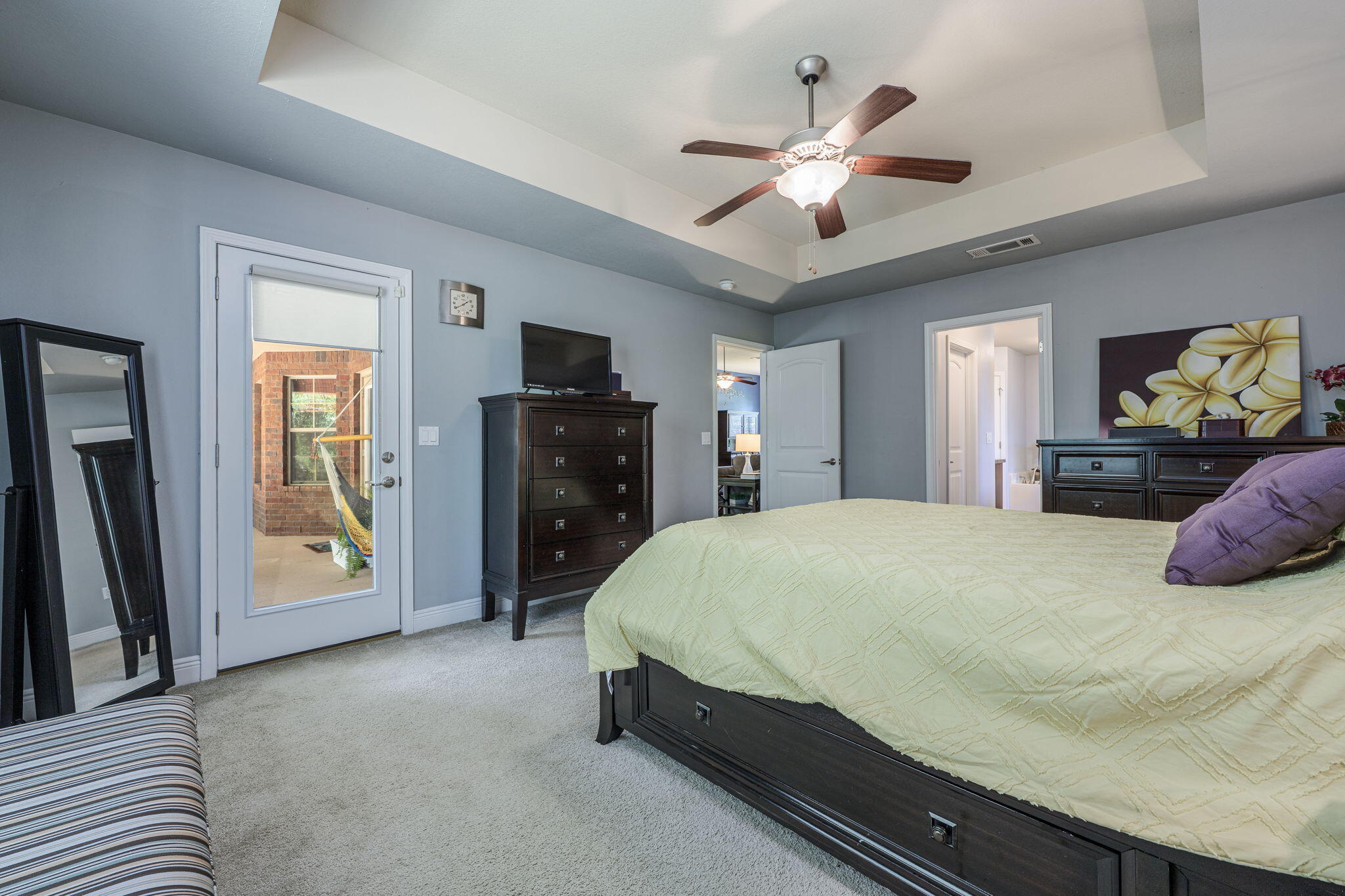 222 Raptor Drive Crestview, FL 32536 - Photo 32 of 70 a bedroom with a large bed and a chandelier