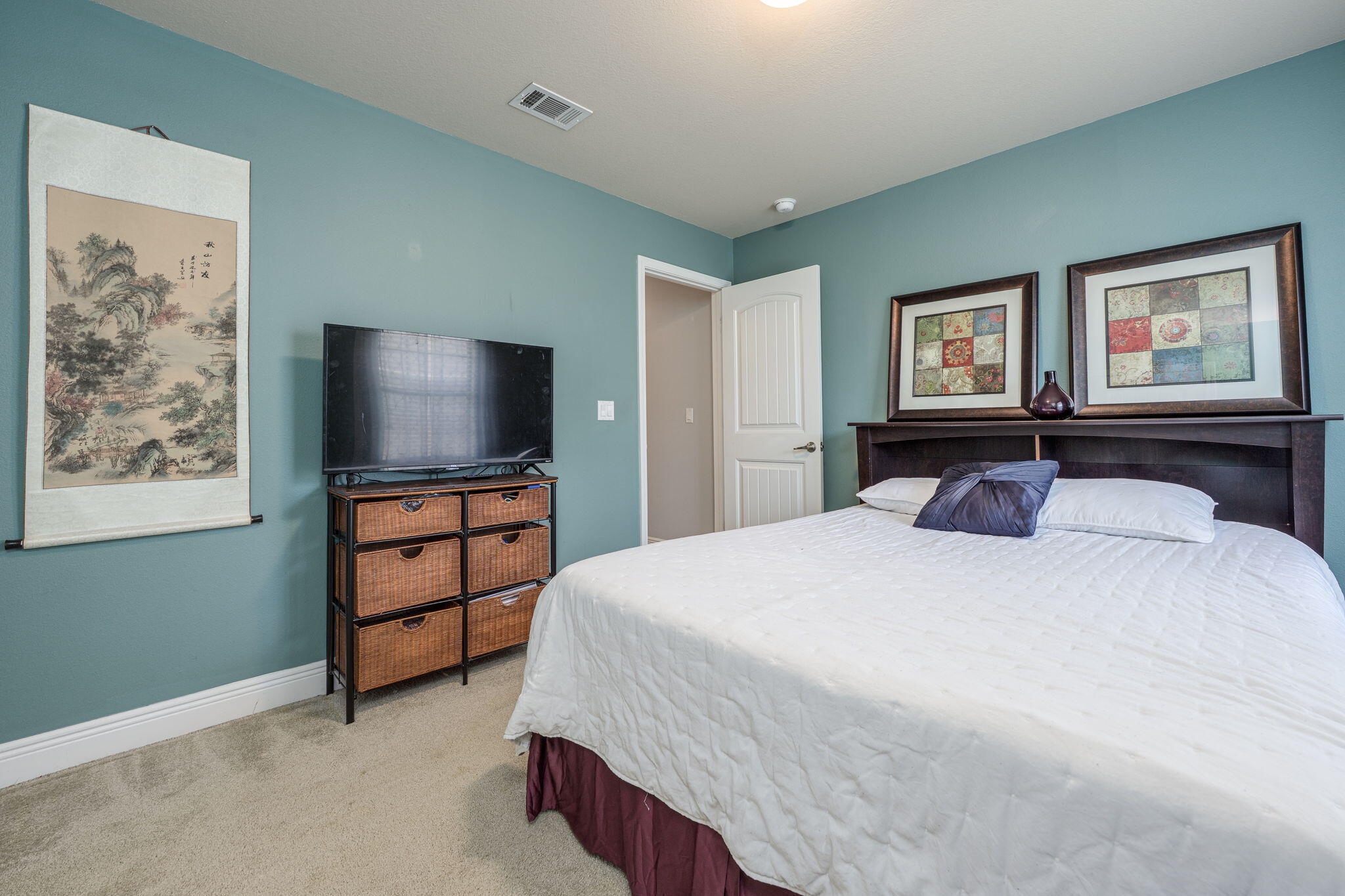 222 Raptor Drive Crestview, FL 32536 - Photo 39 of 70 a bedroom with a bed and a flat screen tv