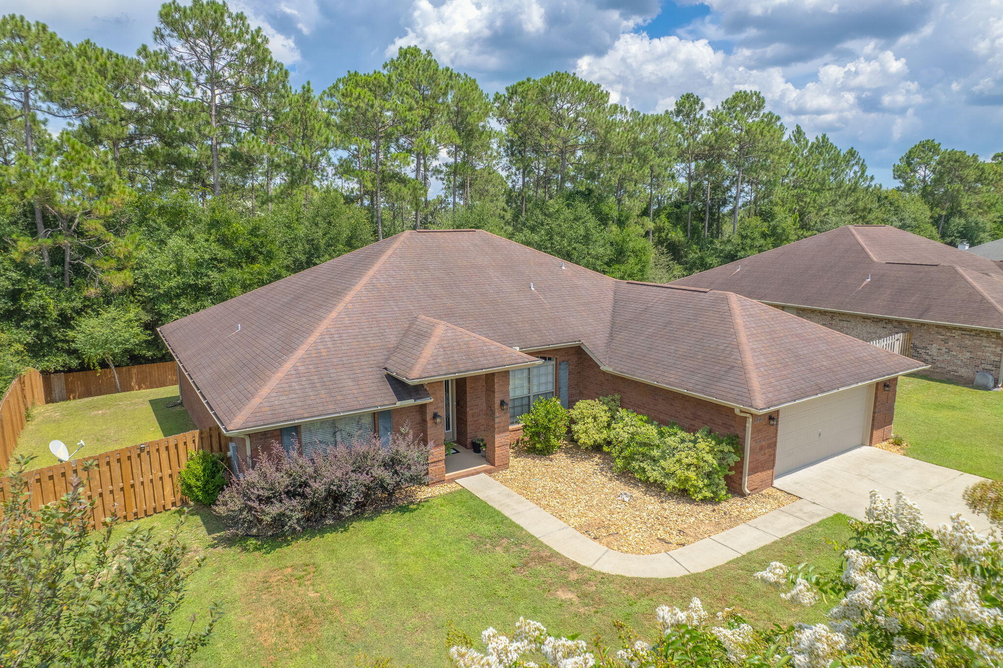 222 Raptor Drive Crestview, FL 32536 - Photo 4 of 70 a aerial view of a house with a yard and a large tree