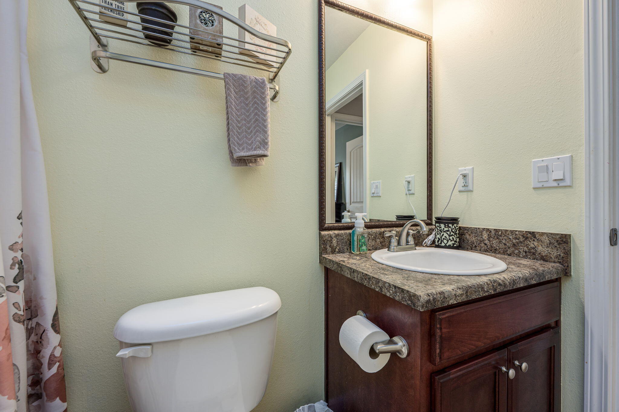 222 Raptor Drive Crestview, FL 32536 - Photo 41 of 70 a bathroom with a granite countertop toilet a sink and a mirror