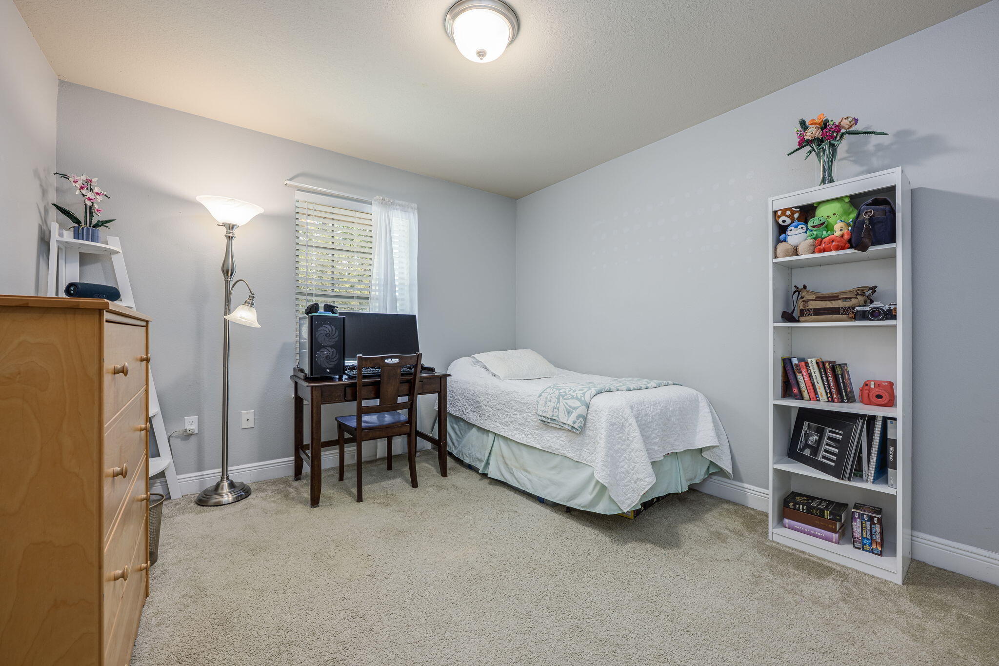 222 Raptor Drive Crestview, FL 32536 - Photo 42 of 70 a bedroom with bed and a book shelf