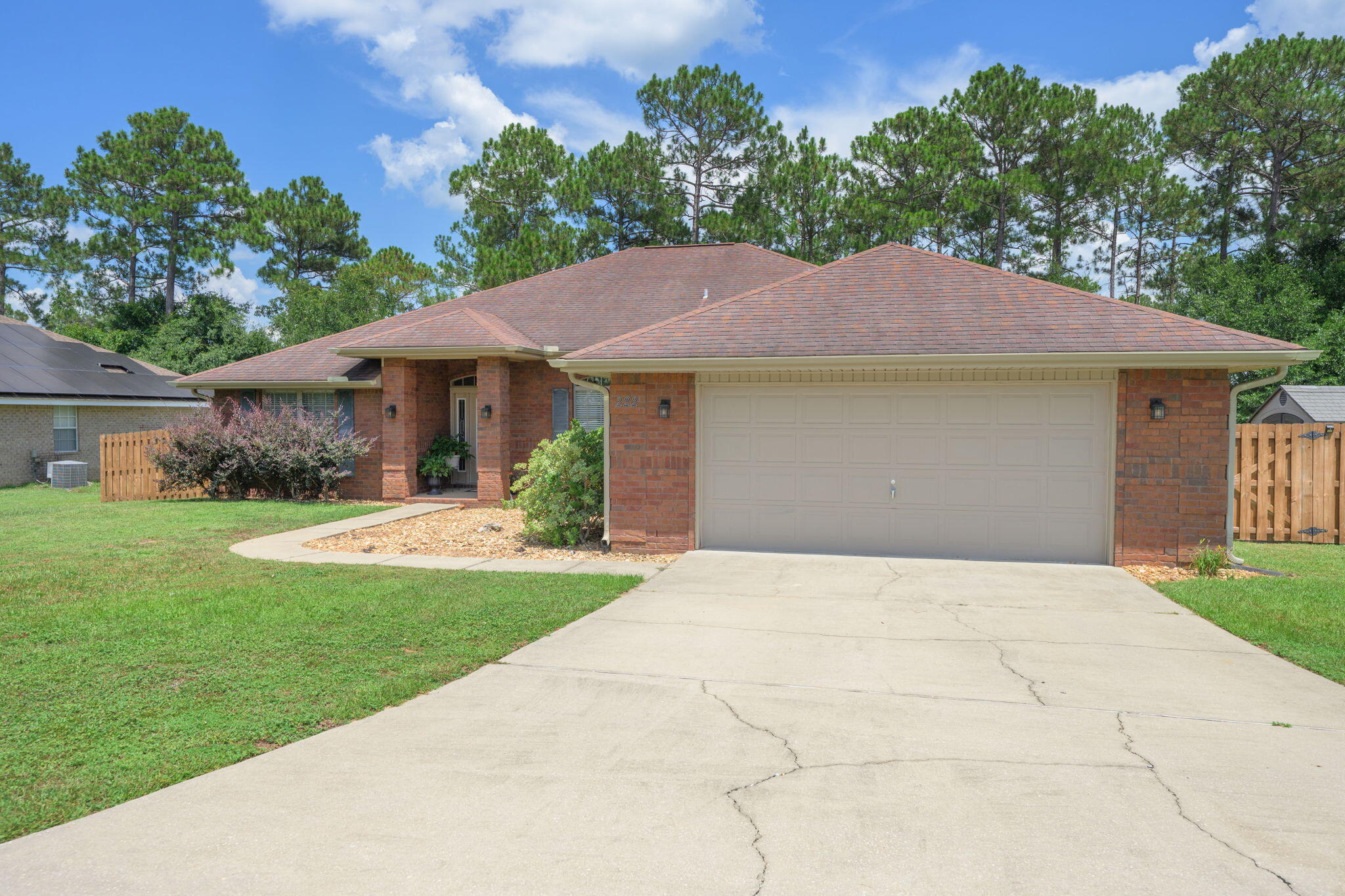 222 Raptor Drive Crestview, FL 32536 - Photo 5 of 70 a front view of a house with garden