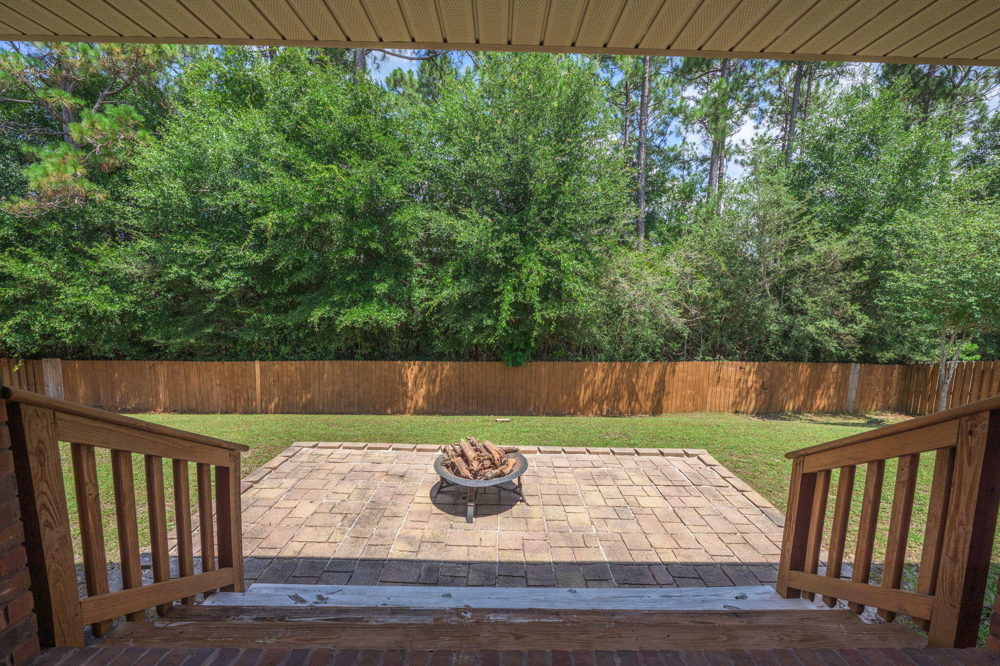 222 Raptor Drive Crestview, FL 32536 - Photo 52 of 70 a view of wooden deck and a yard with wooden fence