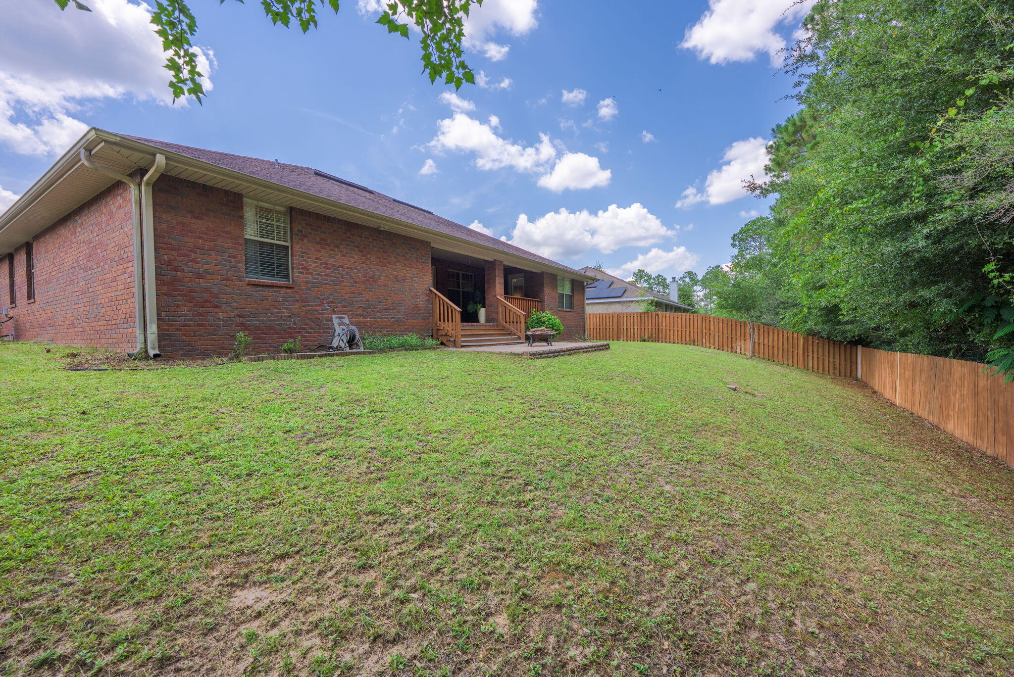 222 Raptor Drive Crestview, FL 32536 - Photo 58 of 70 a backyard of a house with lots of green space