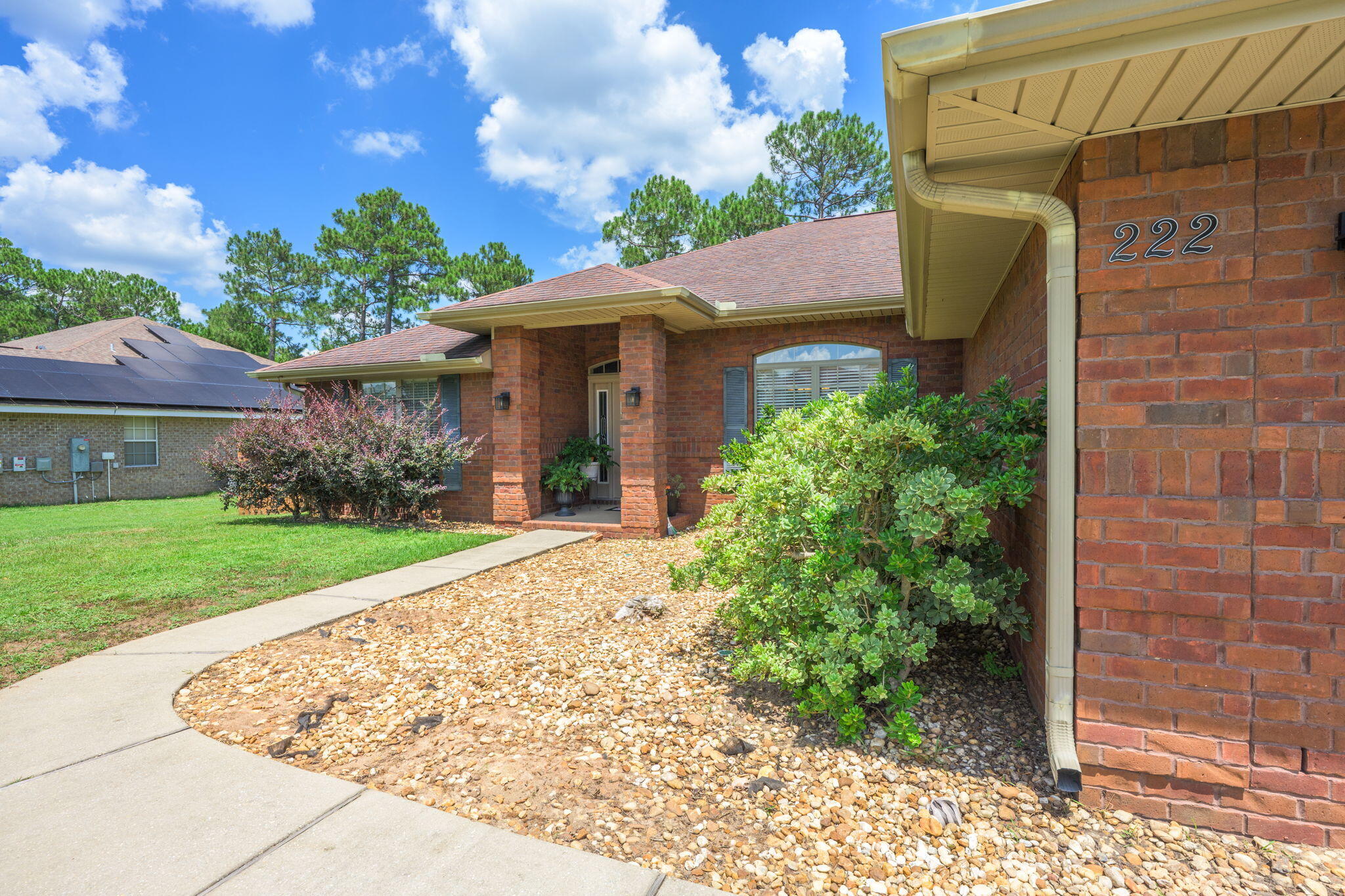 222 Raptor Drive Crestview, FL 32536 - Photo 8 of 70 a front view of a house with garden