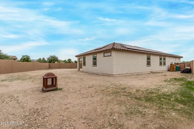 a backyard of a house with lots of trees