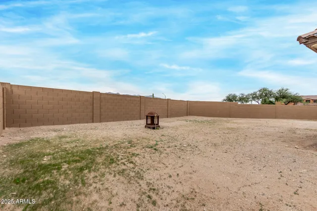 a view of backyard and entertaining space