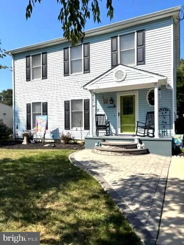a view of a house with swimming pool and sitting area