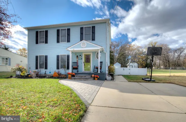 a front view of house with yard outdoor seating and barbeque oven