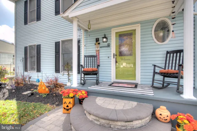 a view of a house with snow on a tree