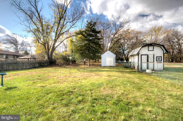 a view of a swimming pool with a yard