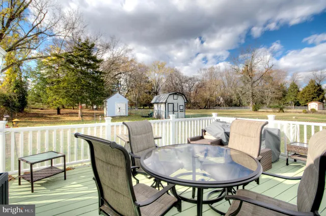 a living room with furniture and a lamp