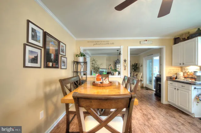 a kitchen view of a dining table chairs and chandelier