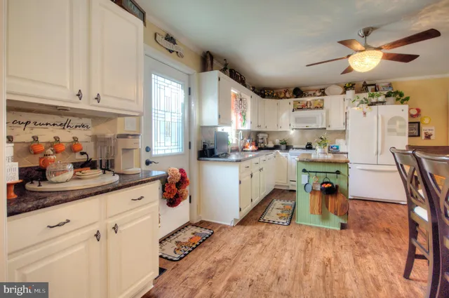 a view of a dining room with furniture and window
