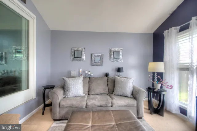 a bathroom with a toilet a sink and a mirror