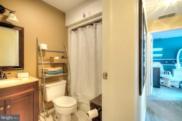 a view of living room with entryway and chandelier
