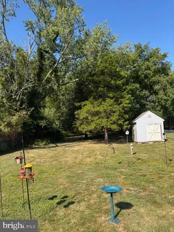 a swimming pool with lawn chairs