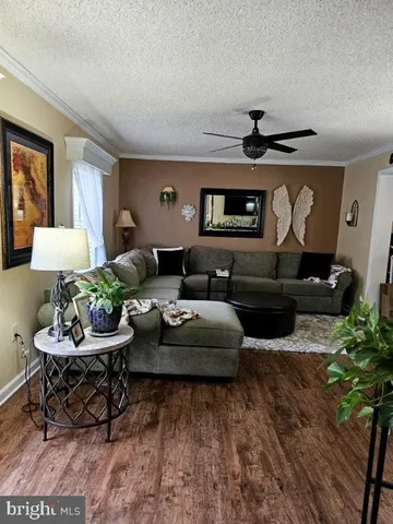 a view of a house with backyard porch and sitting area