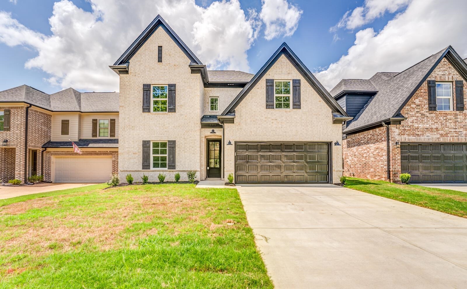 100 Blue Street Oakland, TN 38060 - Photo 1 of 40 a view of an house with backyard and a tree