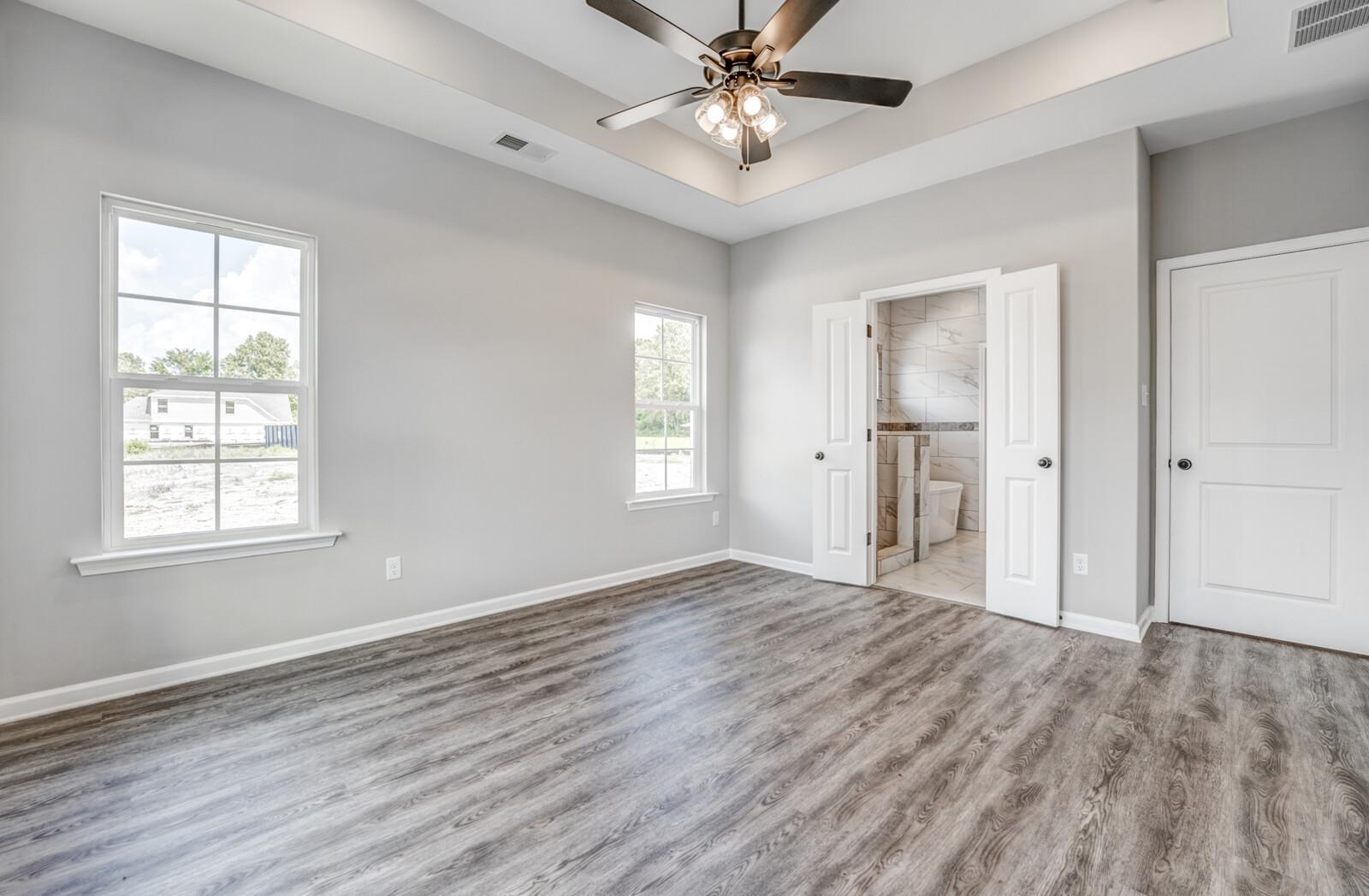 100 Blue Street Oakland, TN 38060 - Photo 20 of 40 wooden floor in an empty room with a window