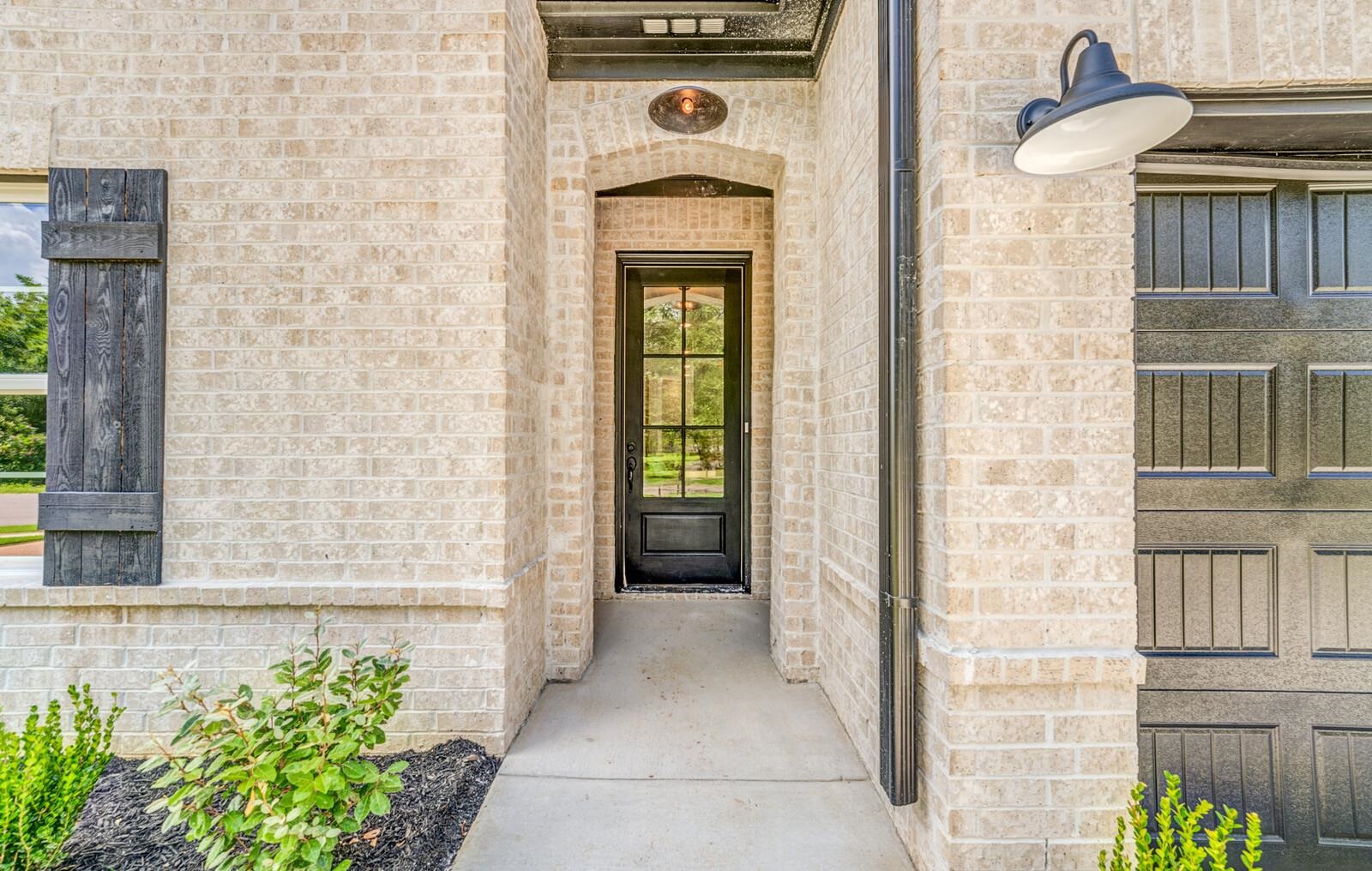 100 Blue Street Oakland, TN 38060 - Photo 2 of 40 a front view of a house with a garden