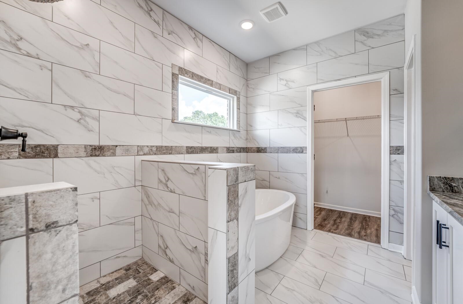 100 Blue Street Oakland, TN 38060 - Photo 24 of 40 a bathroom with a bathtub and shower