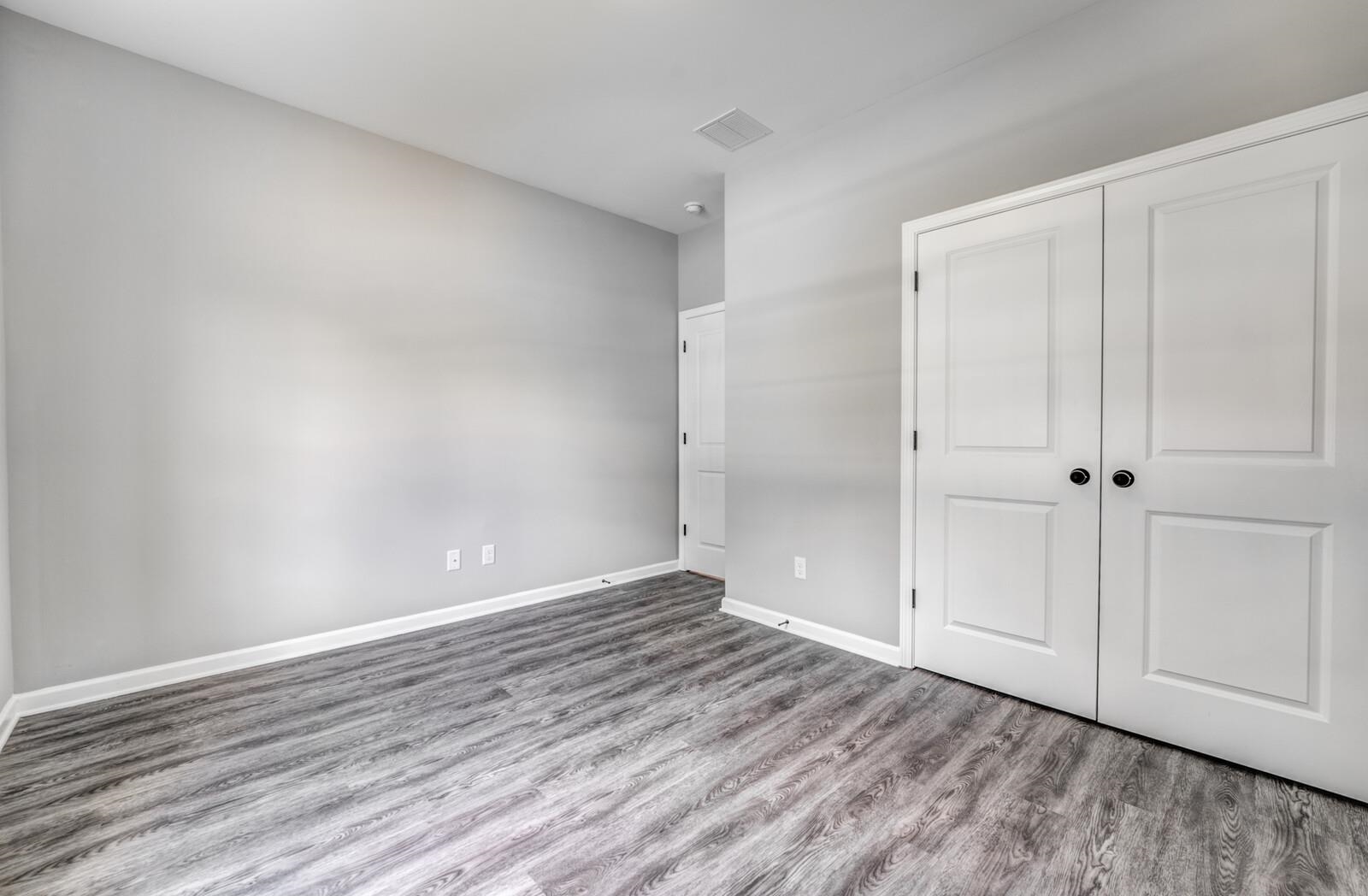 100 Blue Street Oakland, TN 38060 - Photo 27 of 40 a view of an empty room and wooden floor