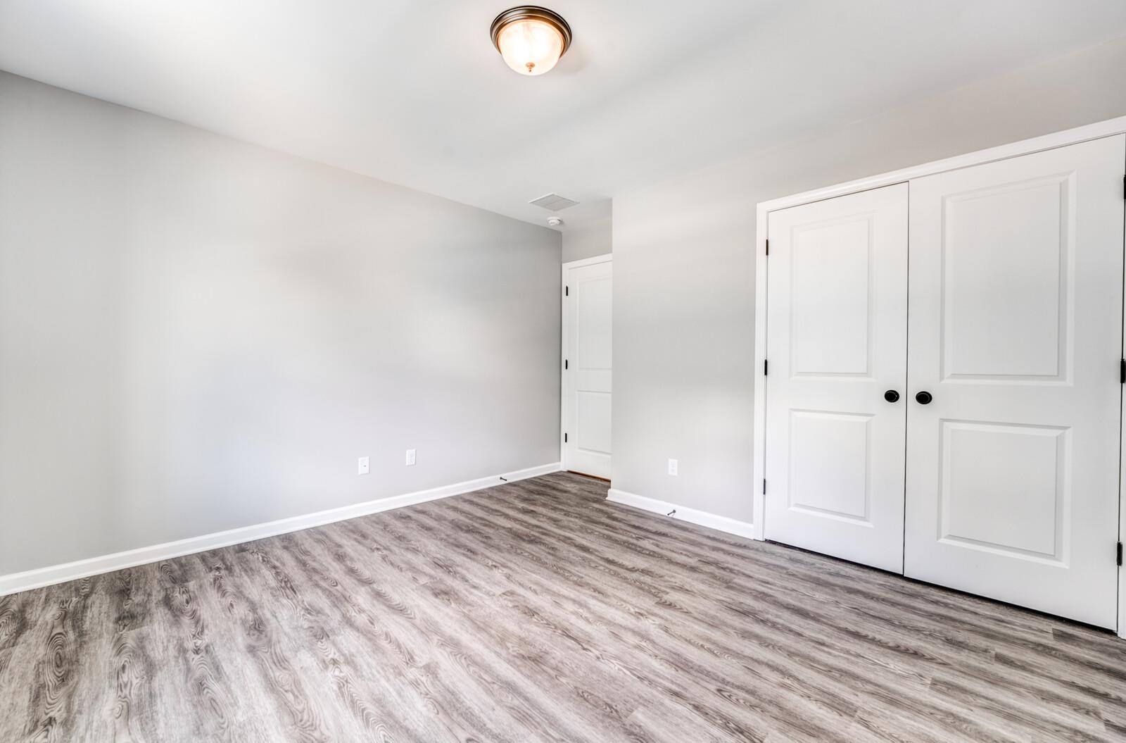 100 Blue Street Oakland, TN 38060 - Photo 30 of 40 a view of empty room with wooden floor