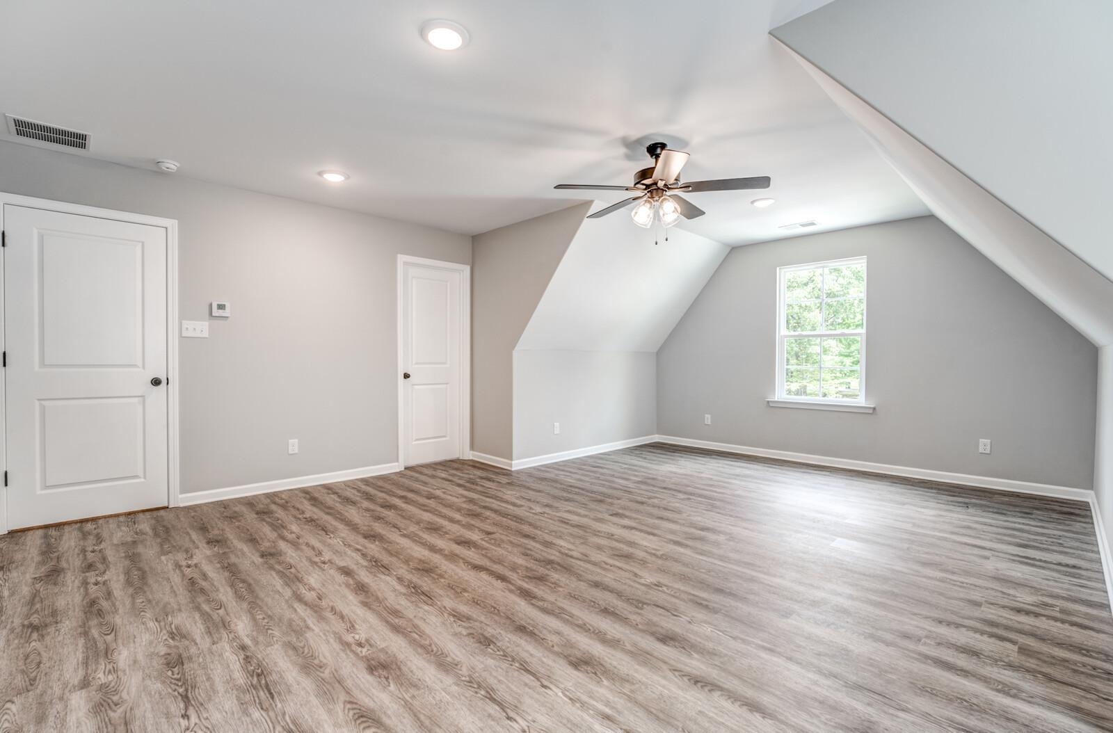 100 Blue Street Oakland, TN 38060 - Photo 35 of 40 wooden floor in an empty room with a window