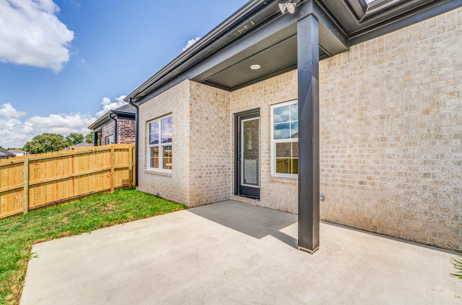 100 Blue Street Oakland, TN 38060 - Photo 39 of 40 a view of a house with a backyard