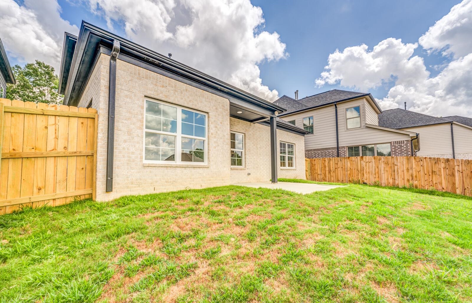 100 Blue Street Oakland, TN 38060 - Photo 40 of 40 a view of a house with backyard and garden