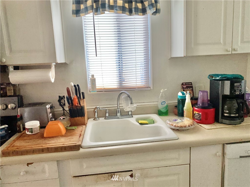 3216 Southeast 5th Street Renton, WA 98058 - Photo 11 of 18 a kitchen with a sink and cabinets