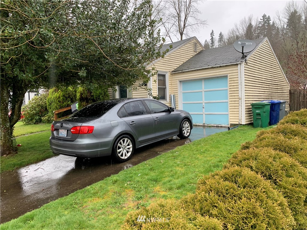 3216 Southeast 5th Street Renton, WA 98058 - Photo 2 of 18 a view of a car in front of house