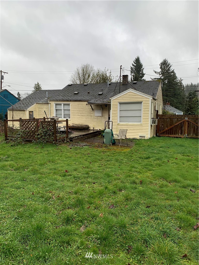 3216 Southeast 5th Street Renton, WA 98058 - Photo 4 of 18 a front view of a house with a yard