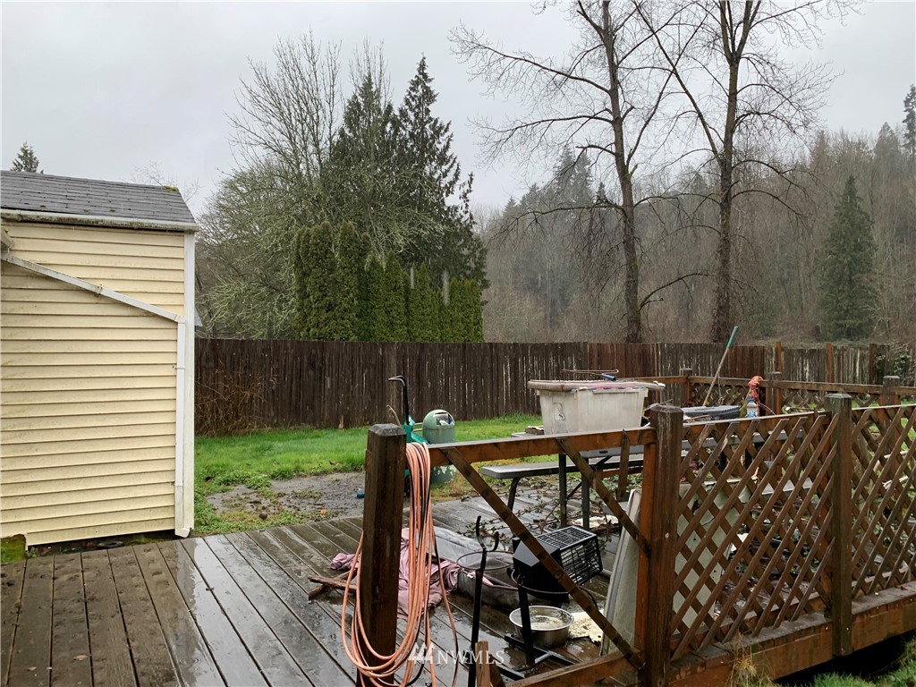 3216 Southeast 5th Street Renton, WA 98058 - Photo 5 of 18 a view of a deck with table and chairs and wooden floor