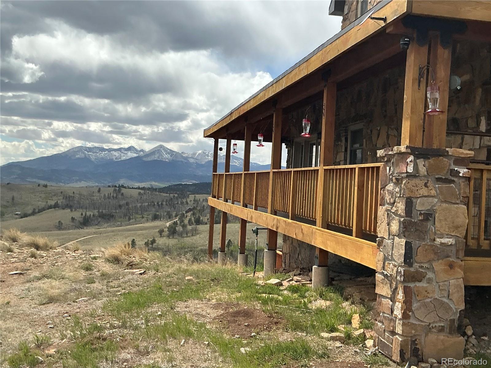 406-449 Schierl Road Fort Garland, CO 81133 - Photo 4 of 50 a view of a house with backyard and wooden fence