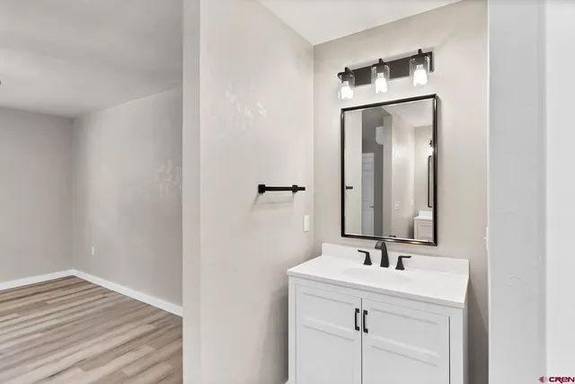 a bathroom with a sink and a mirror