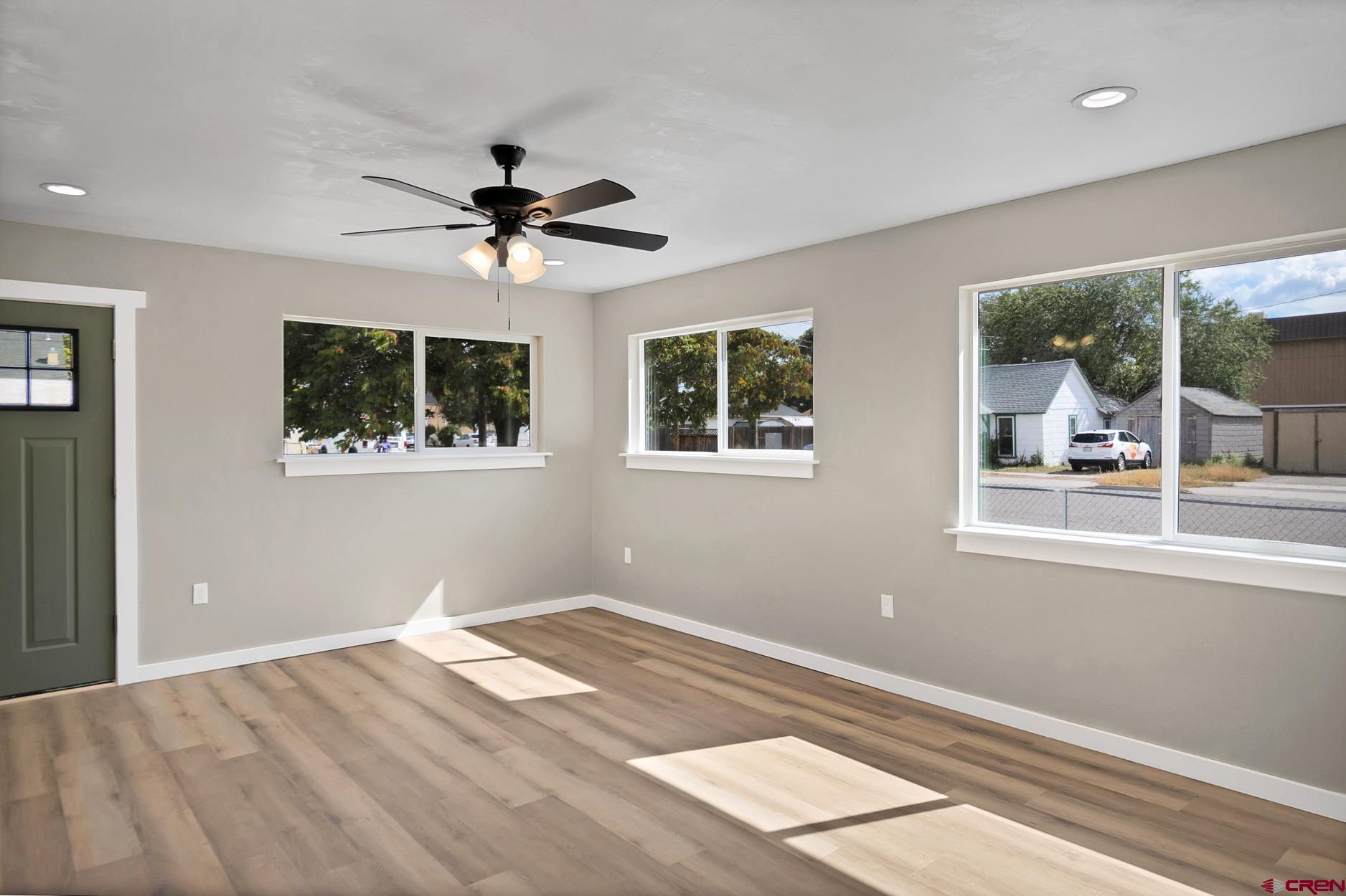 295 West 7th Street Delta, CO 81416 - Photo 26 of 34 a view of a bedroom with wooden floor and a window