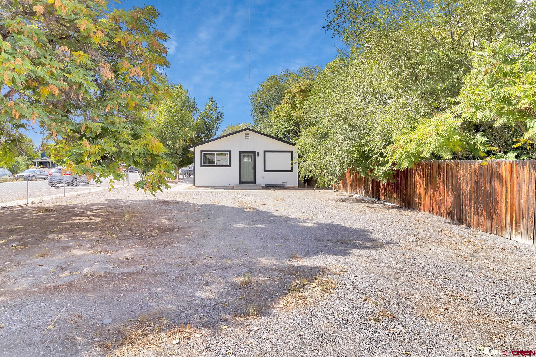 295 West 7th Street Delta, CO 81416 - Photo 30 of 34 a front view of a house with a yard and garage
