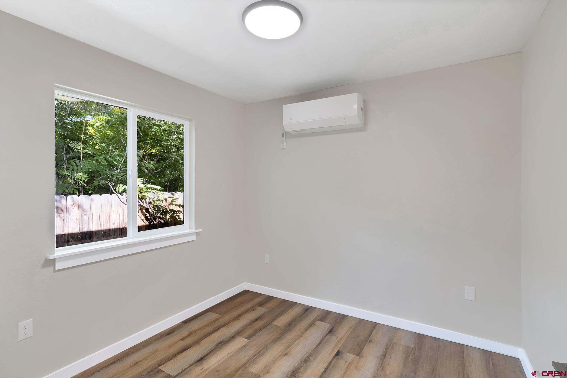 295 West 7th Street Delta, CO 81416 - Photo 4 of 34 a view of a small space with wooden floor and a window